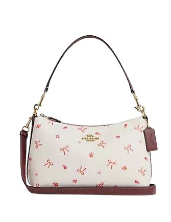 clara shoulder bag with bow print coach|coach purse with bows.